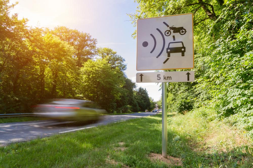 Speed check sign along a road