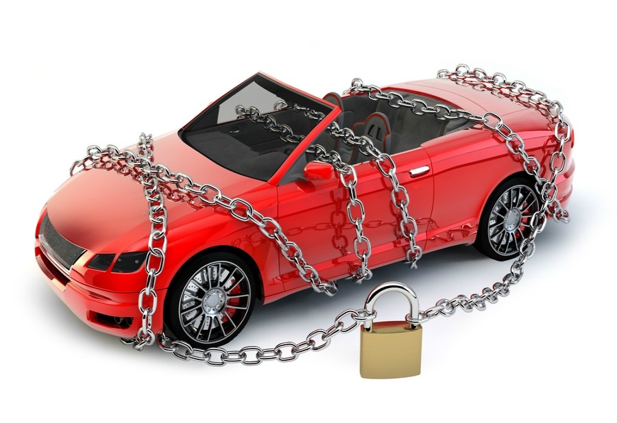 Car surrounded by a chain and padlock symbolising a protected car