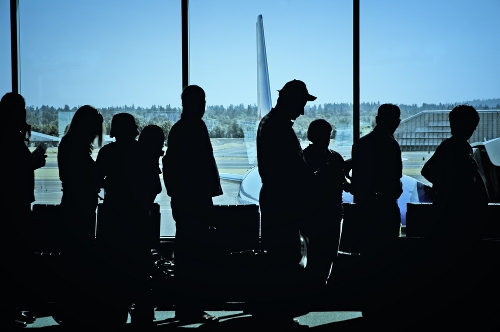 Flight overbooking: passengers queuing to board