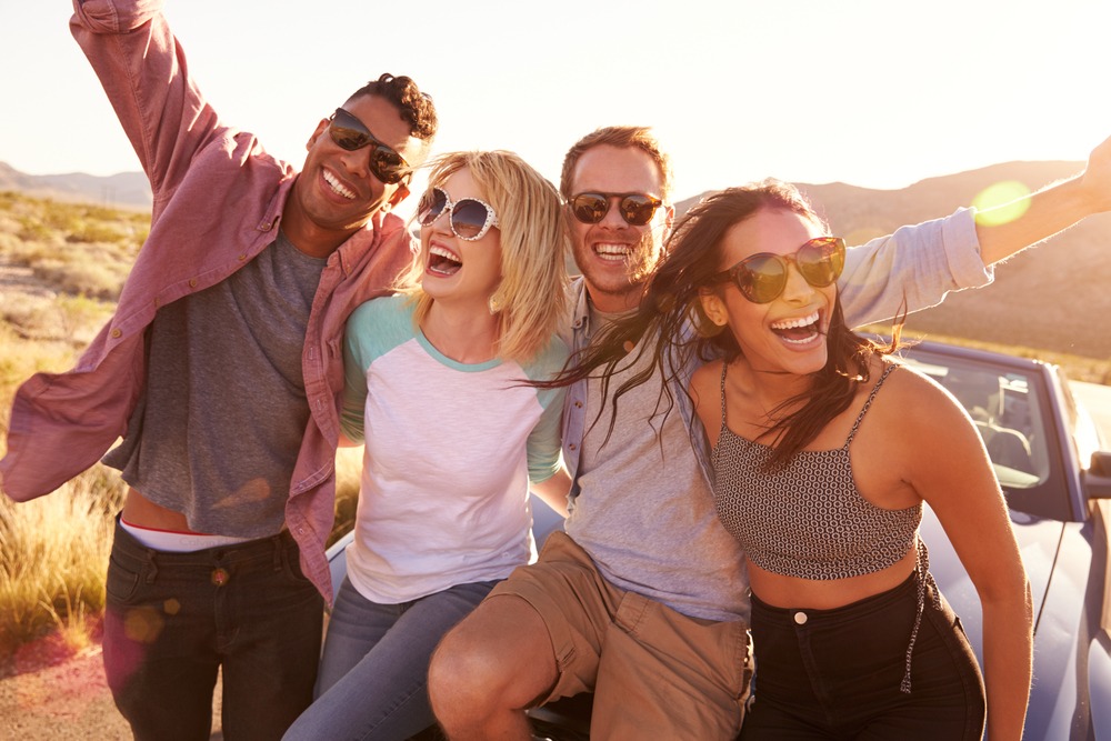 young people on holiday wearing sunglasses