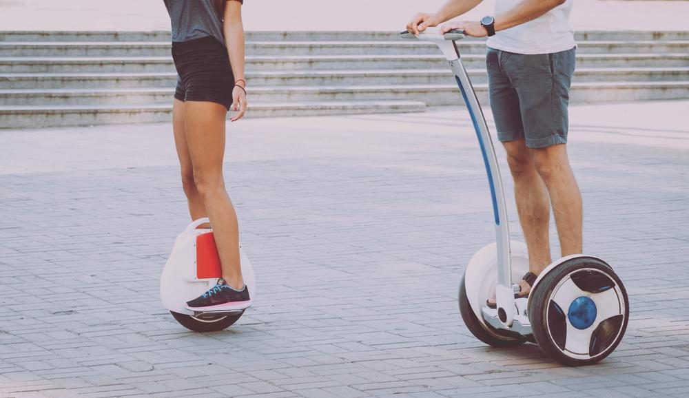 people riding personal mobility devices