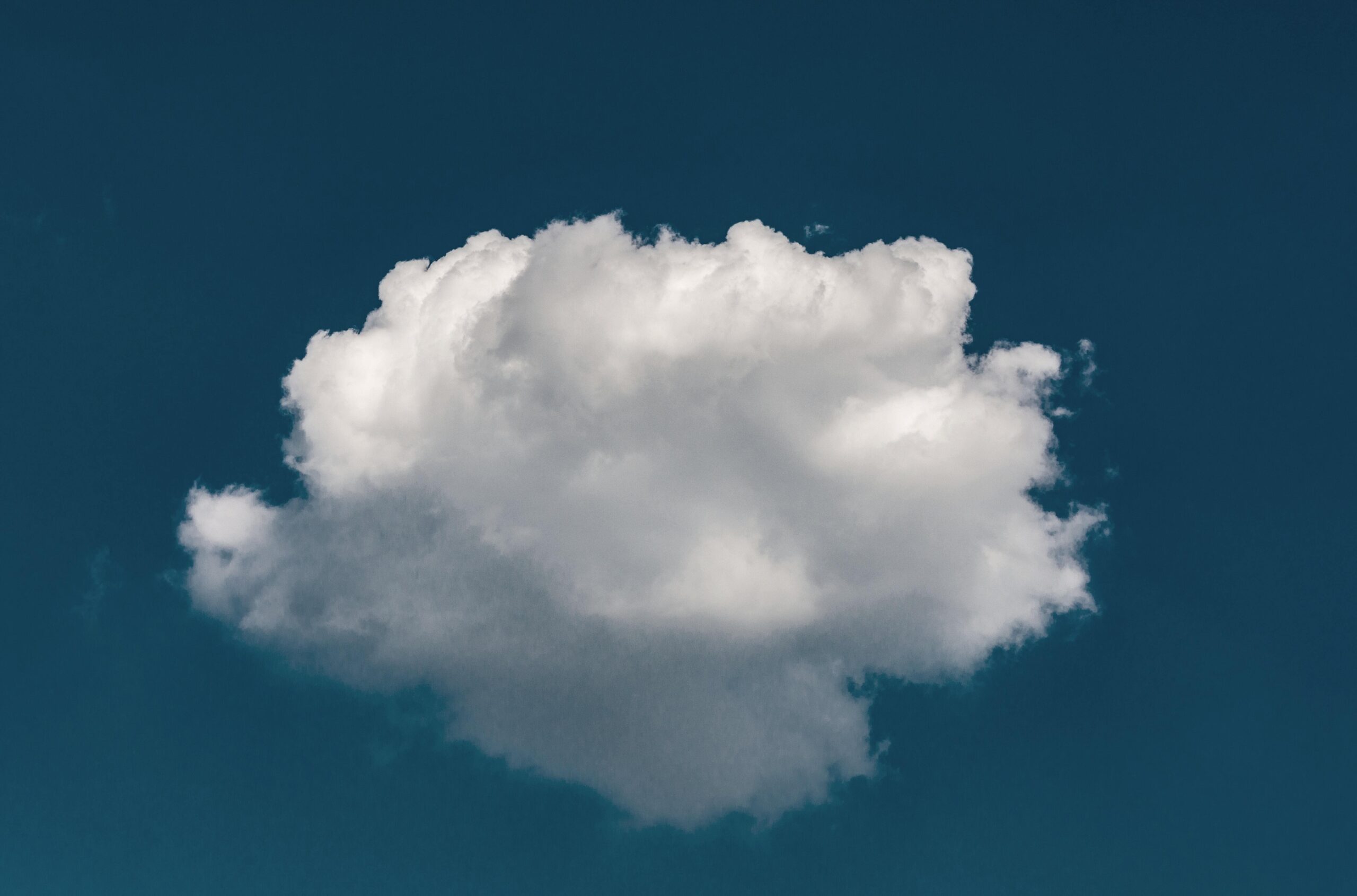 a cloud in a blue sky