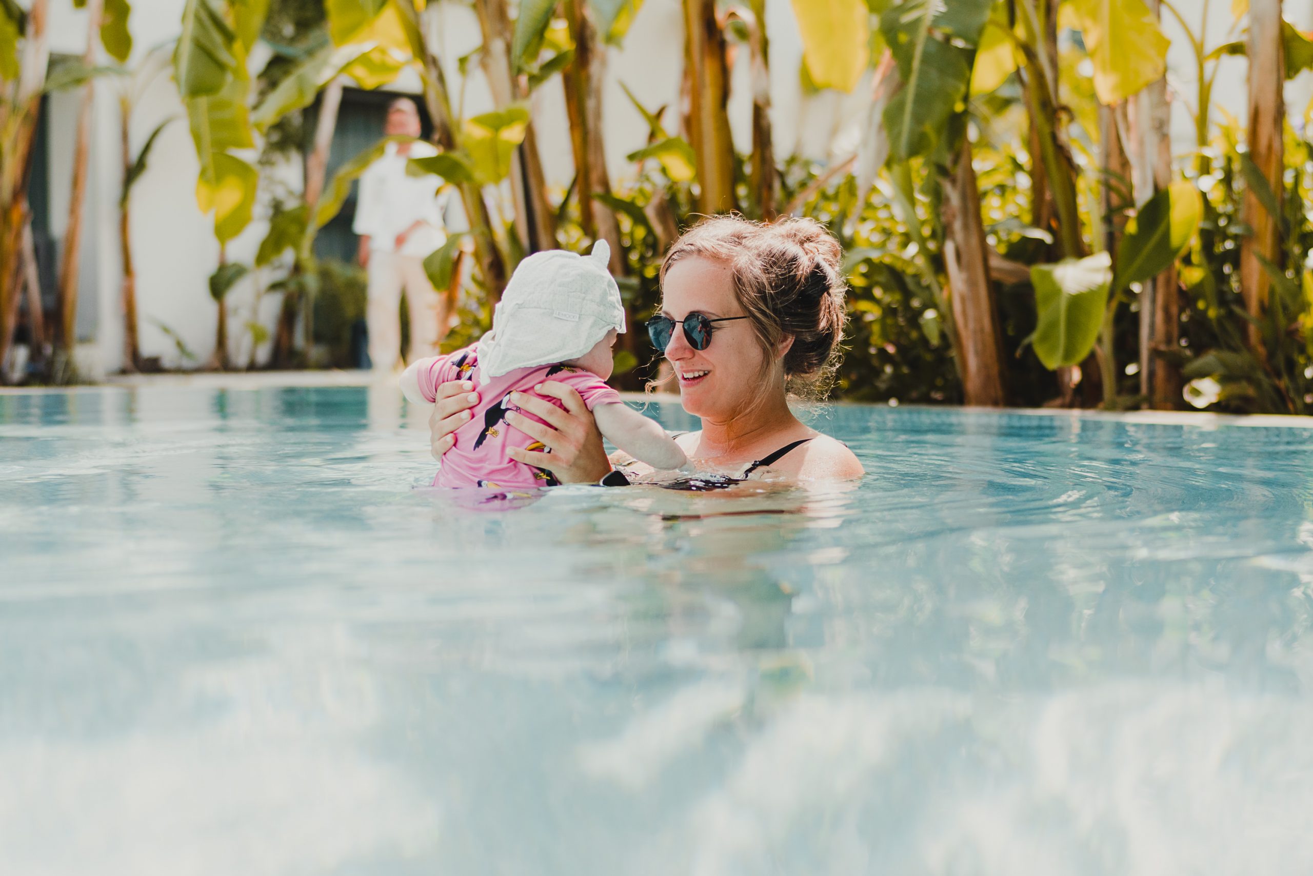 mother with baby in a hotel pool