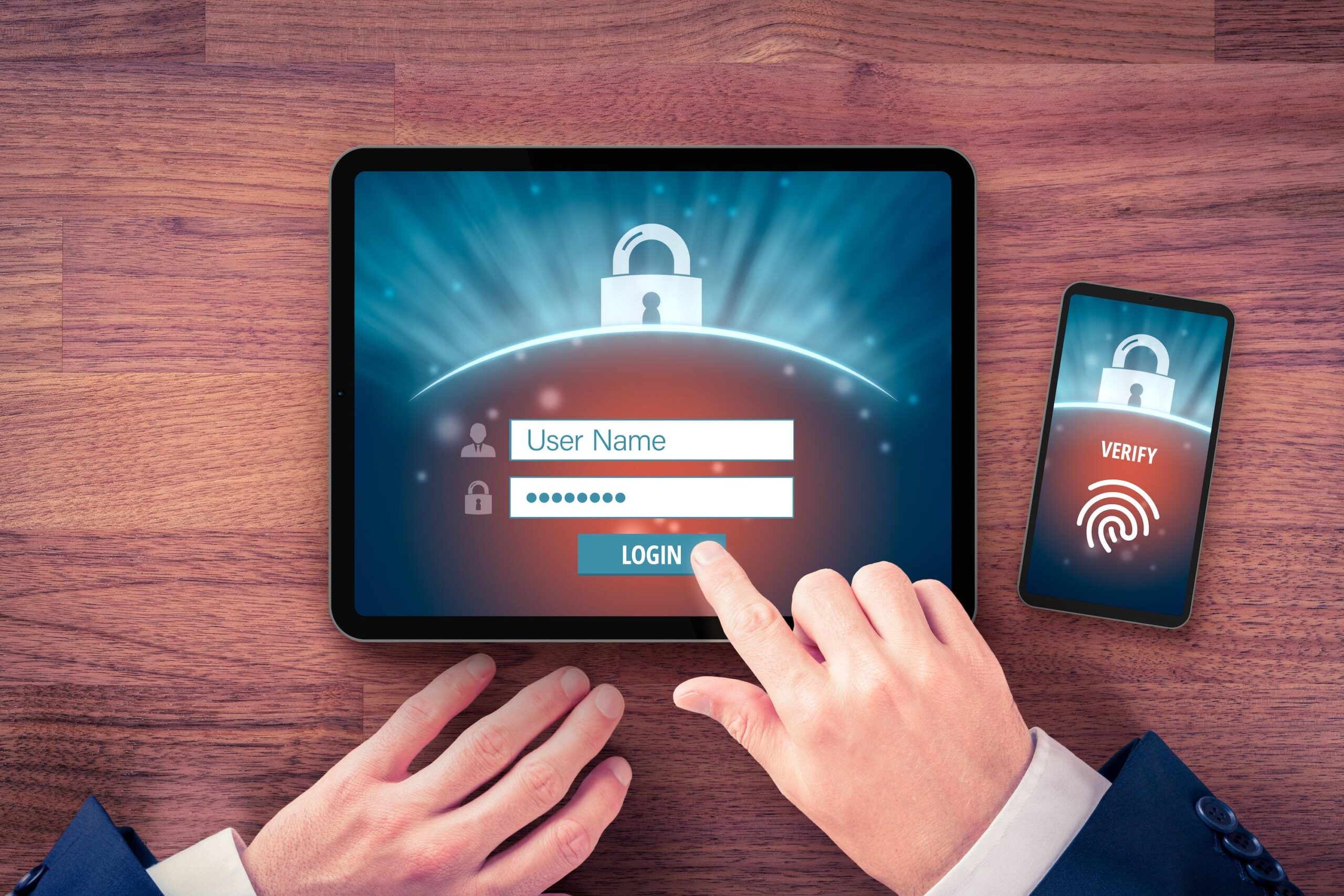 Person using multi-factor authentication on their tablet and smartphone