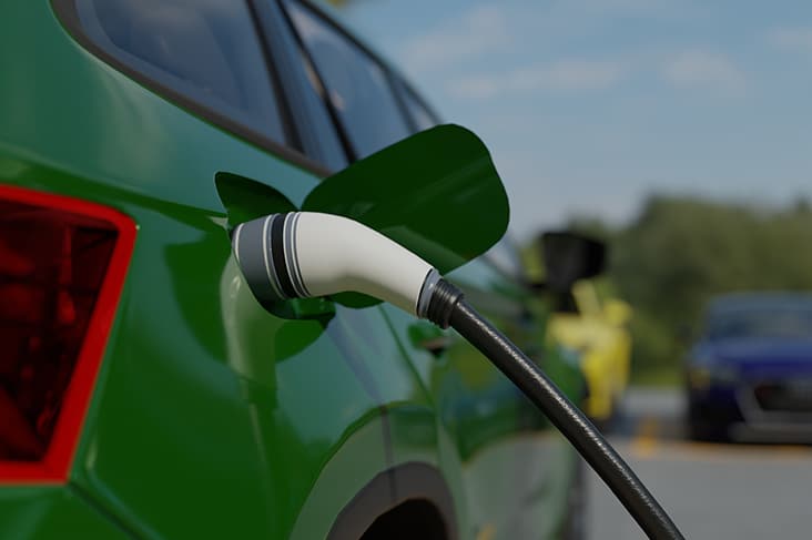 An electric car being recharged with green energy